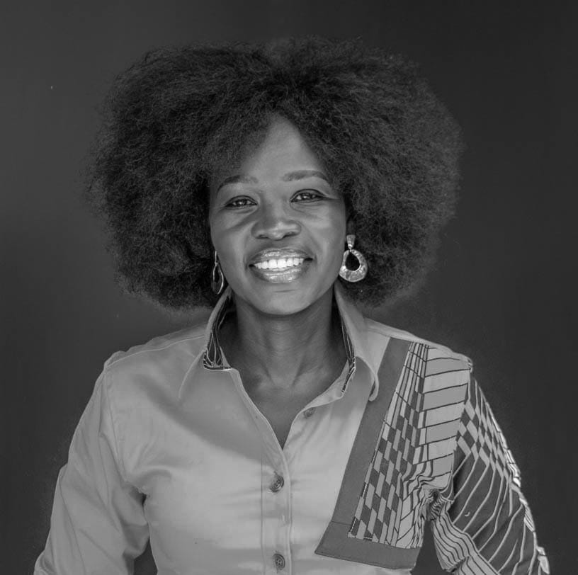 Black-and-white portrait of Ashanut Okille, founder of KaraSpace, smiling