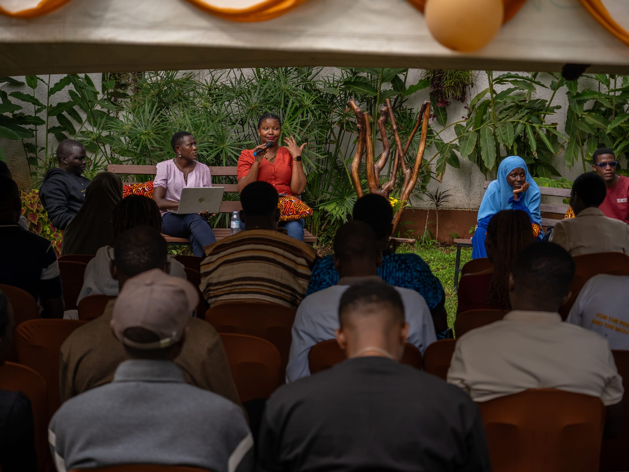 A full audience at a poetry evening in the garden