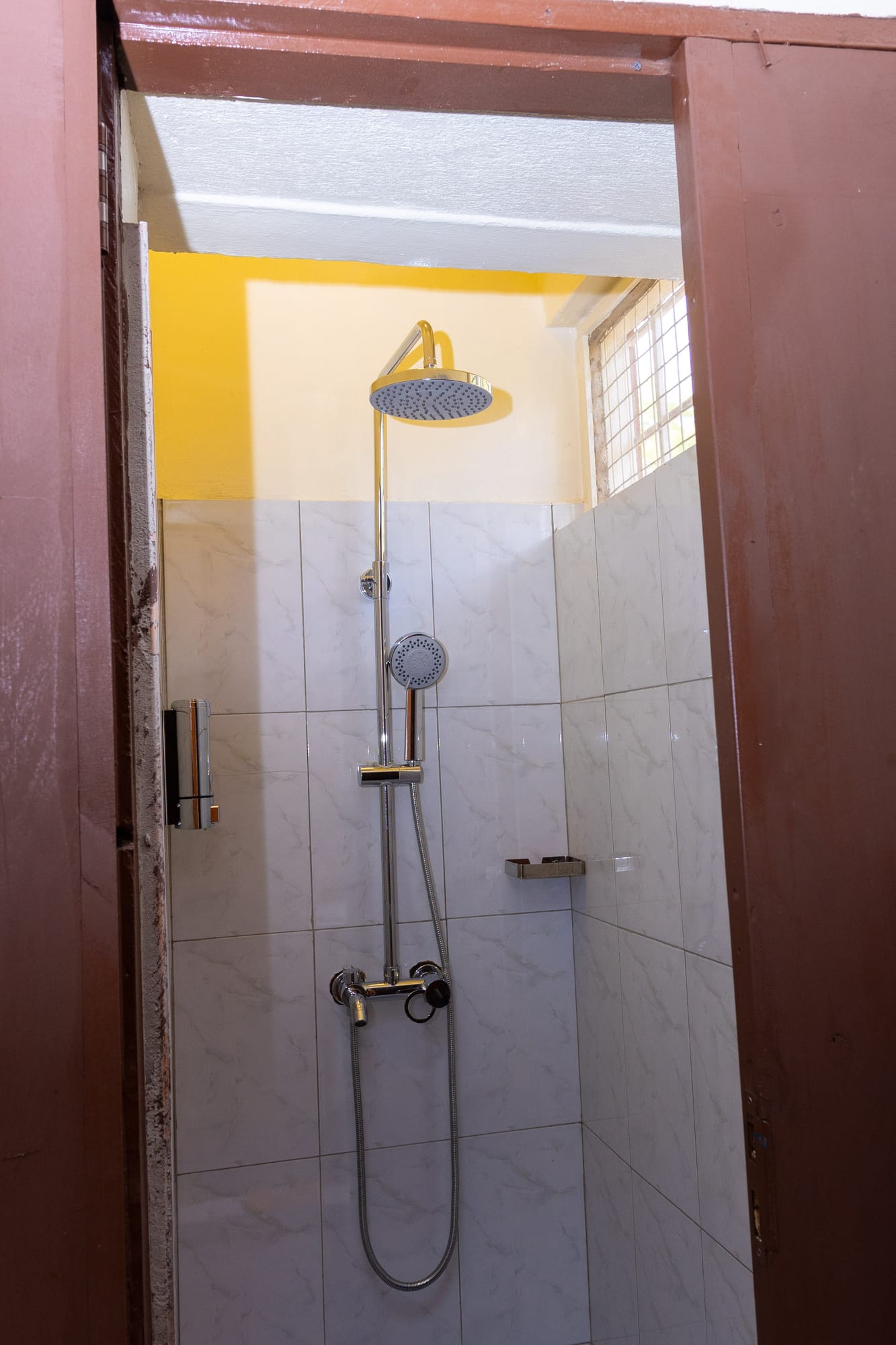 Standard Room — the private tiled shower with a rainfall head